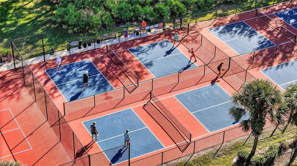 209 Robin Hood Circle, Unit 201 Naples, FL 34104 - Photo 24 of 29 an outdoor space with seating