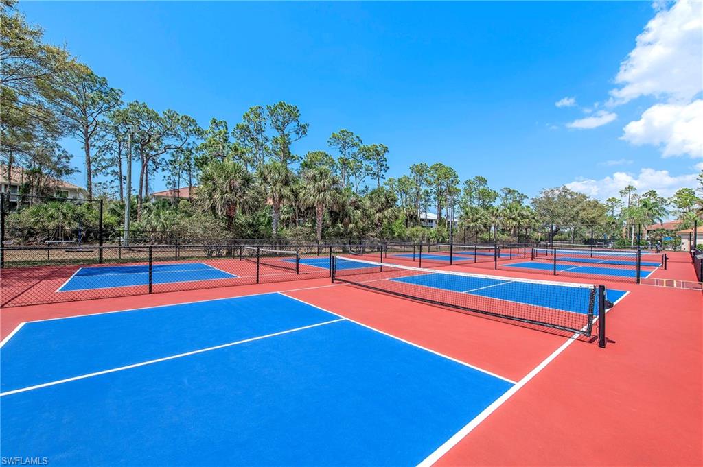 209 Robin Hood Circle, Unit 201 Naples, FL 34104 - Photo 27 of 29 a view of a tennis court