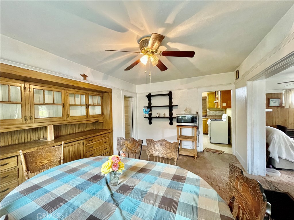 4474 Highland Place Riverside, CA 92506 - Photo 15 of 22 a bedroom with furniture and a chandelier