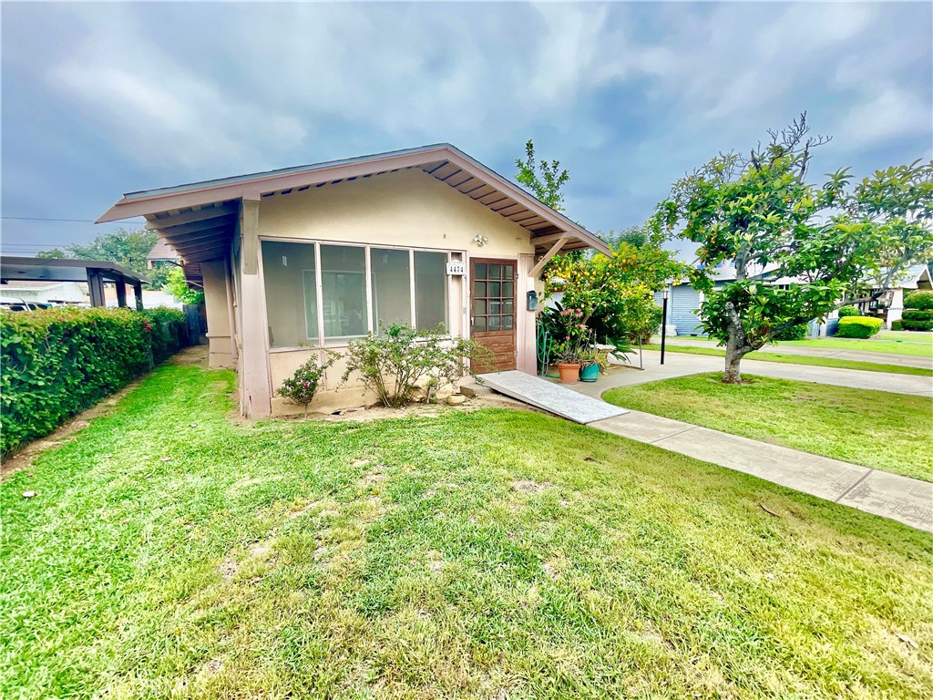 4474 Highland Place Riverside, CA 92506 - Photo 3 of 22 a front view of a house with garden