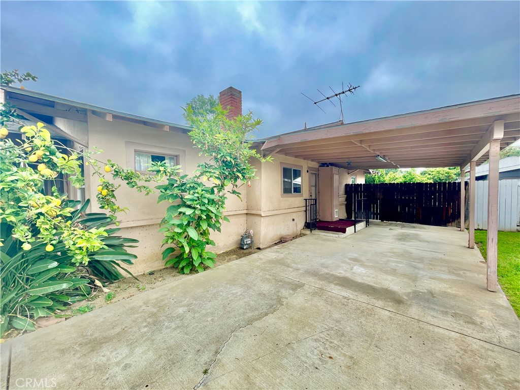 4474 Highland Place Riverside, CA 92506 - Photo 4 of 22 a front view of a house with a yard and a garage