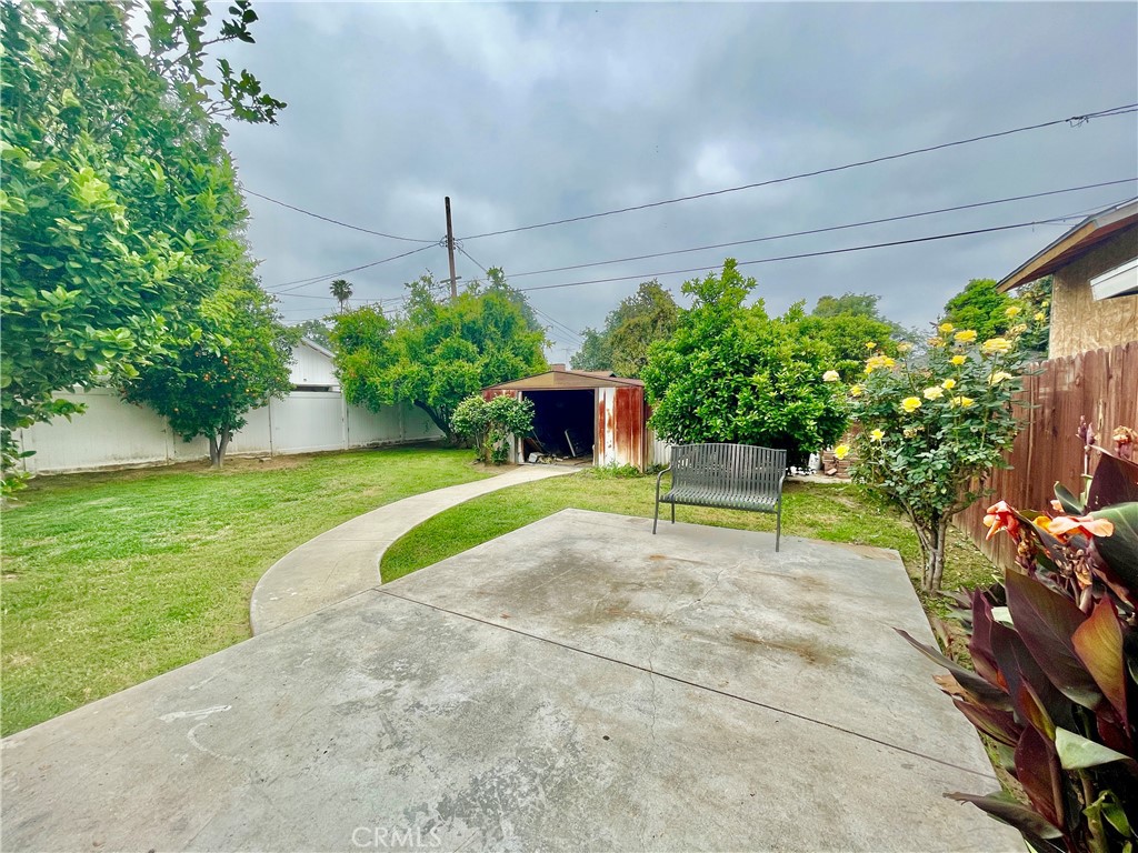4474 Highland Place Riverside, CA 92506 - Photo 6 of 22 a view of a garden with a bench