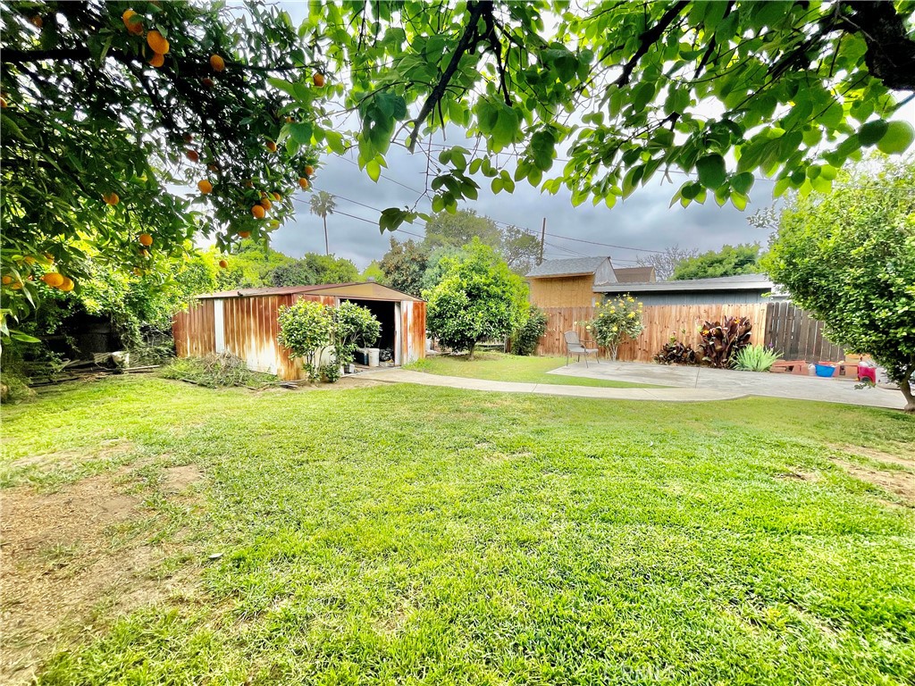 4474 Highland Place Riverside, CA 92506 - Photo 7 of 22 a front view of a house with garden