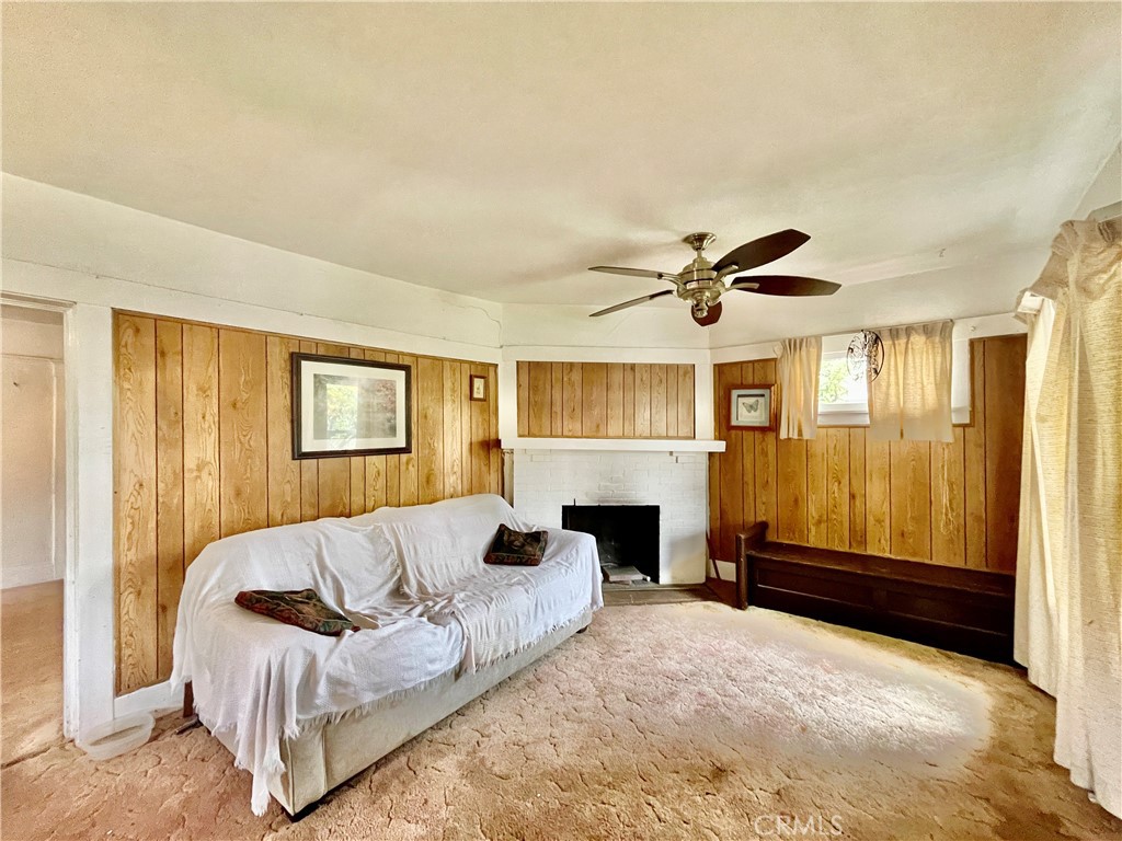 4474 Highland Place Riverside, CA 92506 - Photo 10 of 22 a living room with furniture and a fireplace