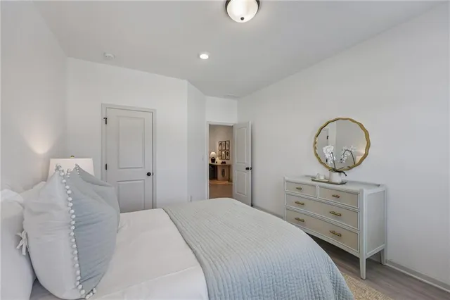 a living room with furniture a fireplace and a floor to ceiling window