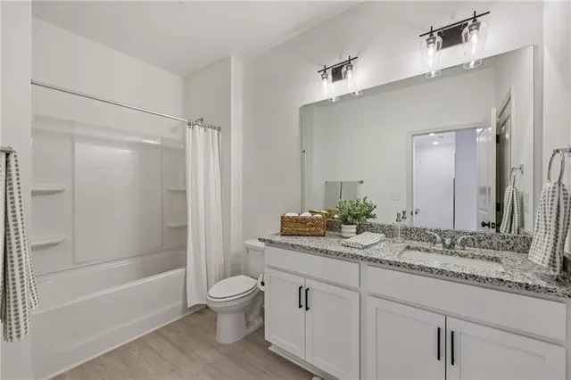 a view of a chairs and a table in the balcony