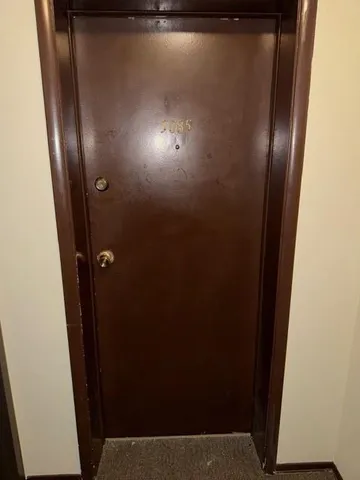 an empty room with wooden floor