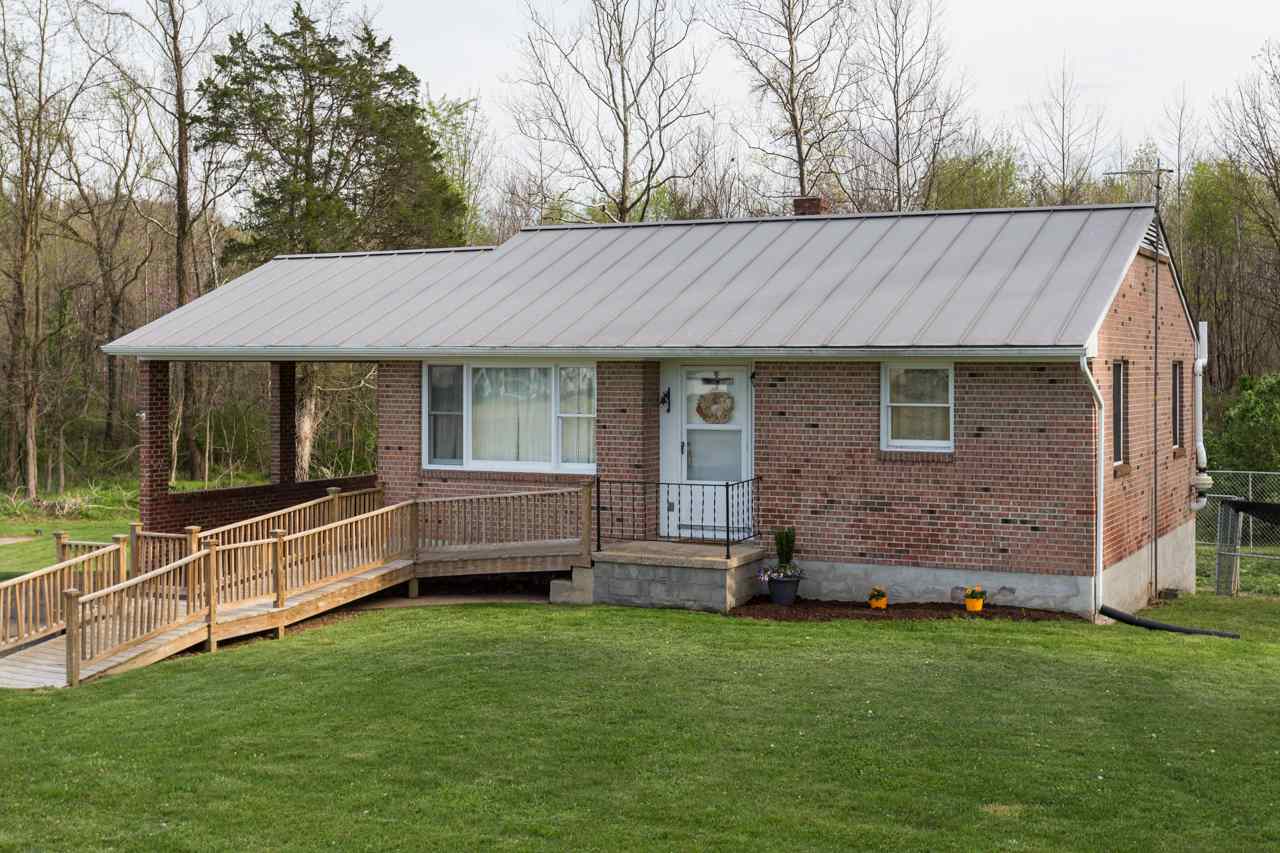 1119 North River Road Mount Solon, VA 22843 - Photo 16 of 24 a view of a house with a garden and yard