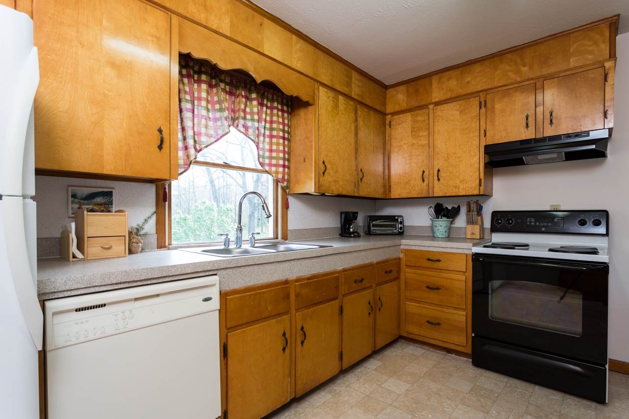 1119 North River Road Mount Solon, VA 22843 - Photo 2 of 24 a kitchen with cabinets appliances a sink and a counter top space