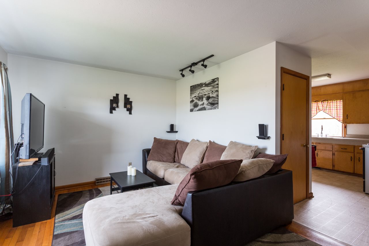 1119 North River Road Mount Solon, VA 22843 - Photo 6 of 24 a living room with furniture and a flat screen tv