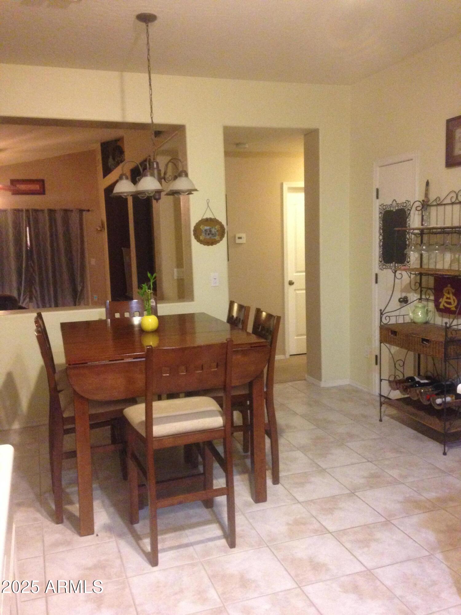 861 South Honeysuckle Lane Gilbert, AZ 85296 - Photo 4 of 10 a view of a dining room with furniture