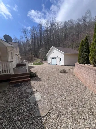 a view of a backyard of a house