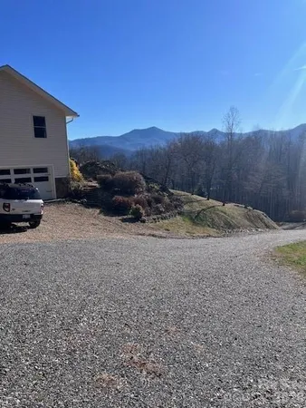 a view of a backyard of the house