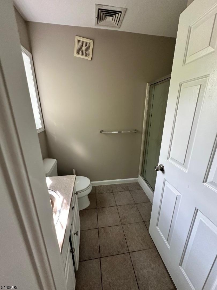63 Garret Street, Unit 2 Paterson, NJ 07501 - Photo 7 of 9 a bathroom with a toilet