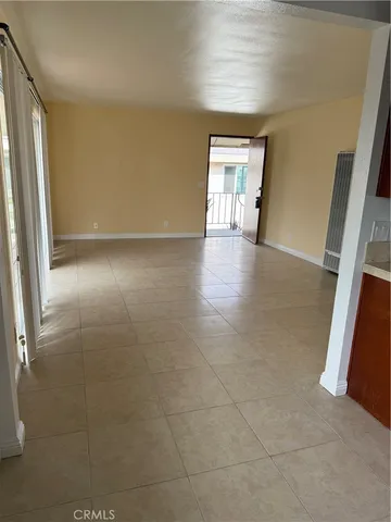a kitchen with a stove top oven and cabinets