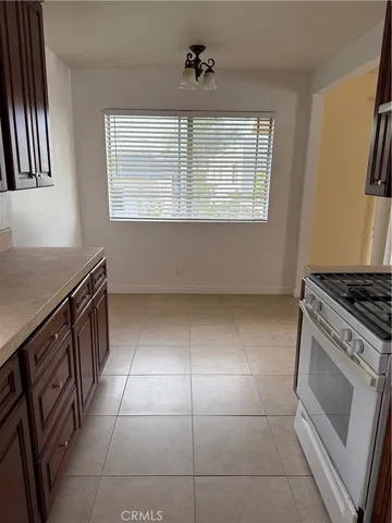 a white refrigerator freezer freezer sitting in a kitchen
