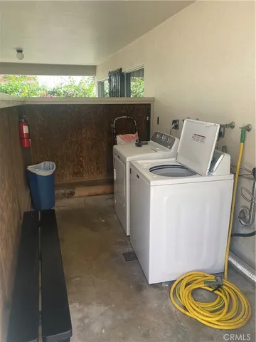 a kitchen with stainless steel appliances kitchen island granite countertop a sink and wooden cabinets