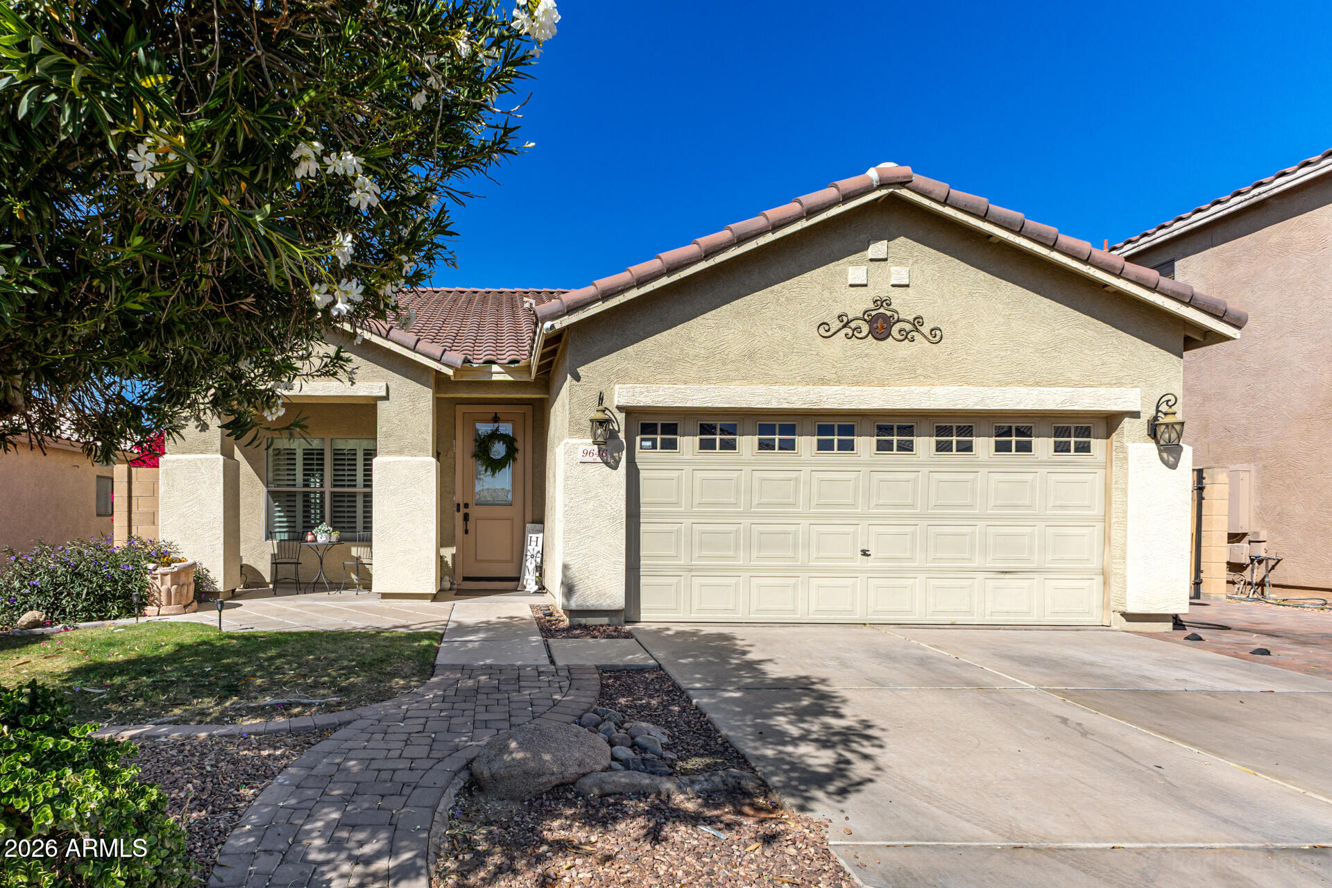 9646 West Payson Road Tolleson, AZ 85353 - Photo 1 of 36 a front view of a house with a yard