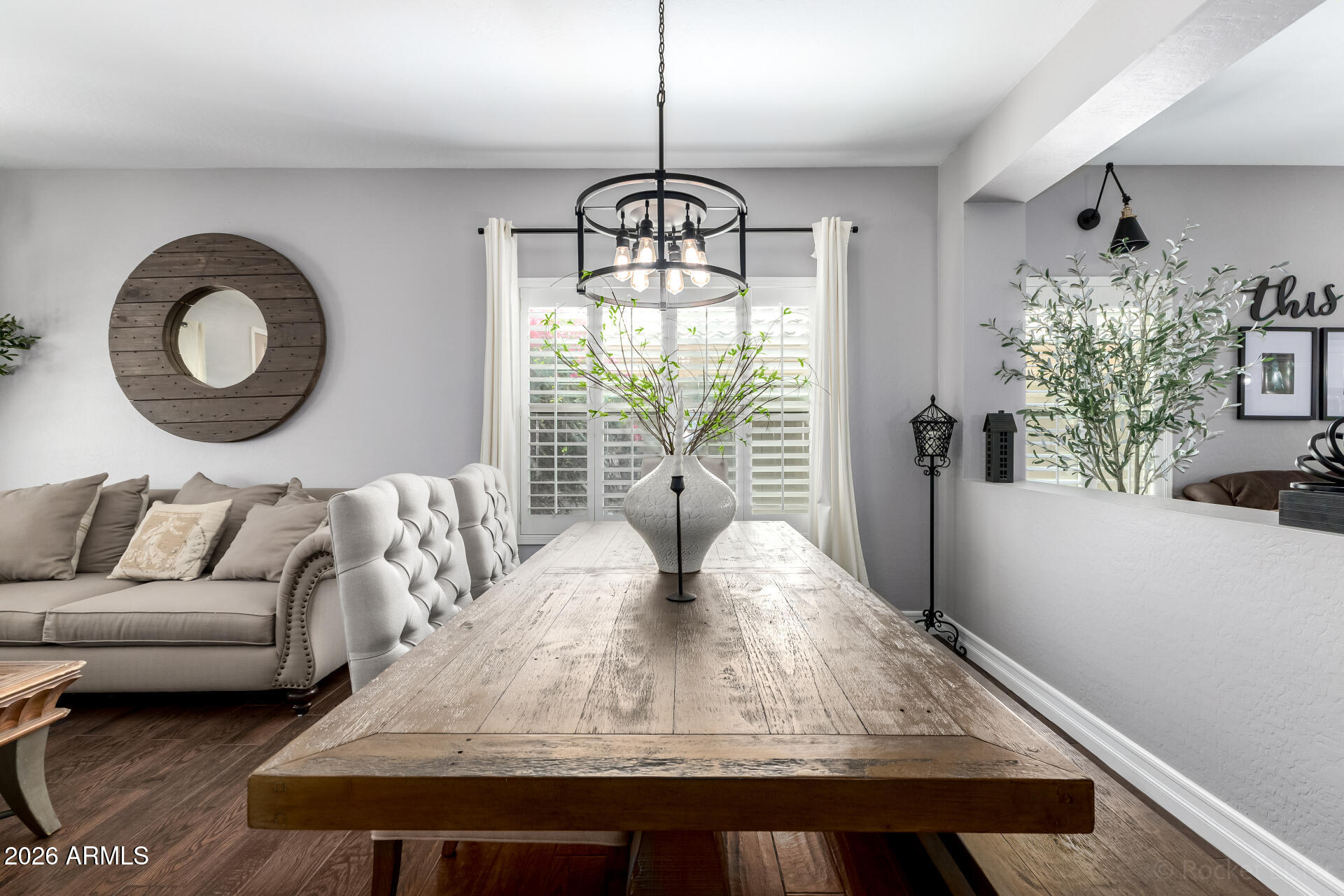 9646 West Payson Road Tolleson, AZ 85353 - Photo 11 of 36 a living room with furniture and a chandelier