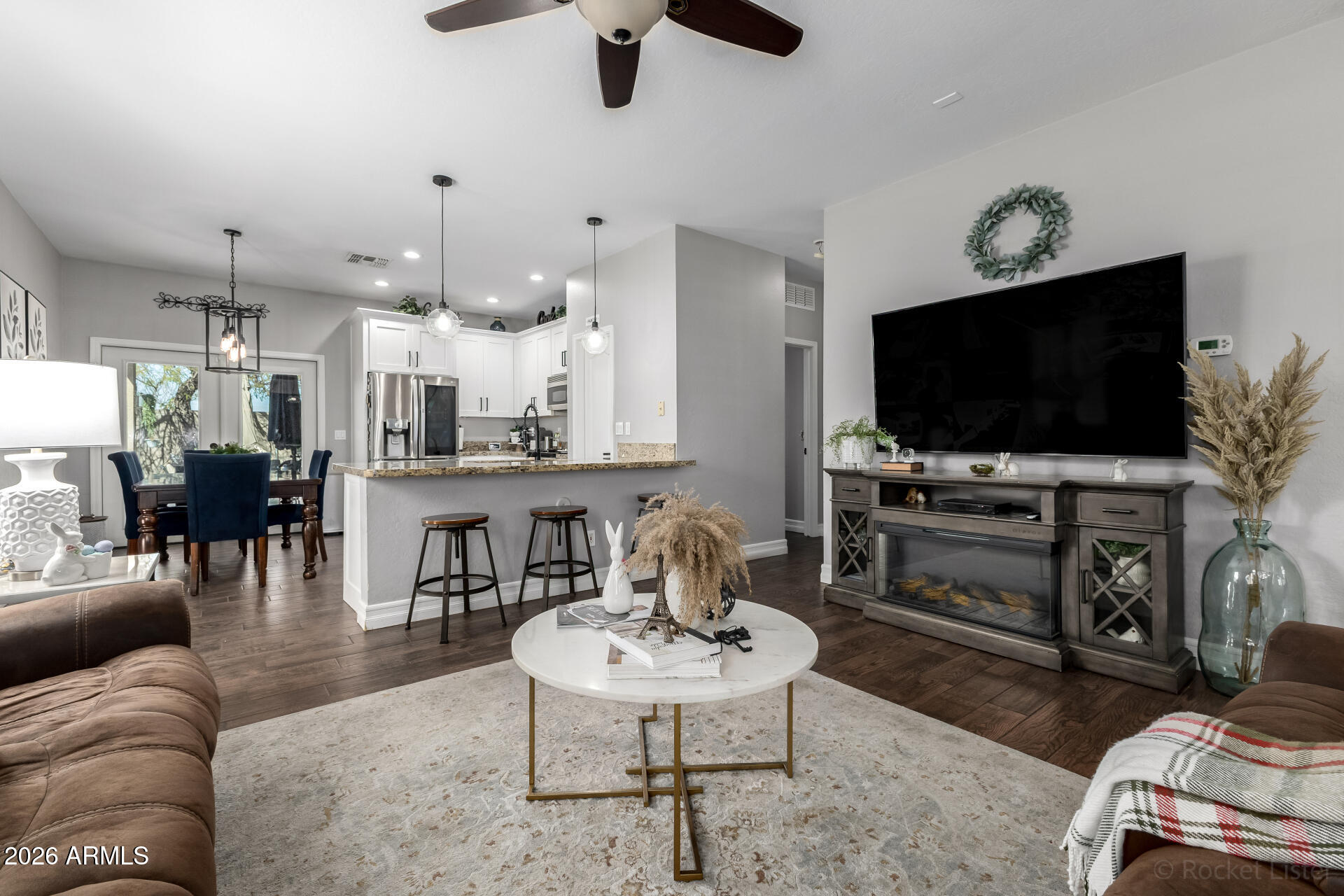 9646 West Payson Road Tolleson, AZ 85353 - Photo 14 of 36 a living room with furniture and a flat screen tv