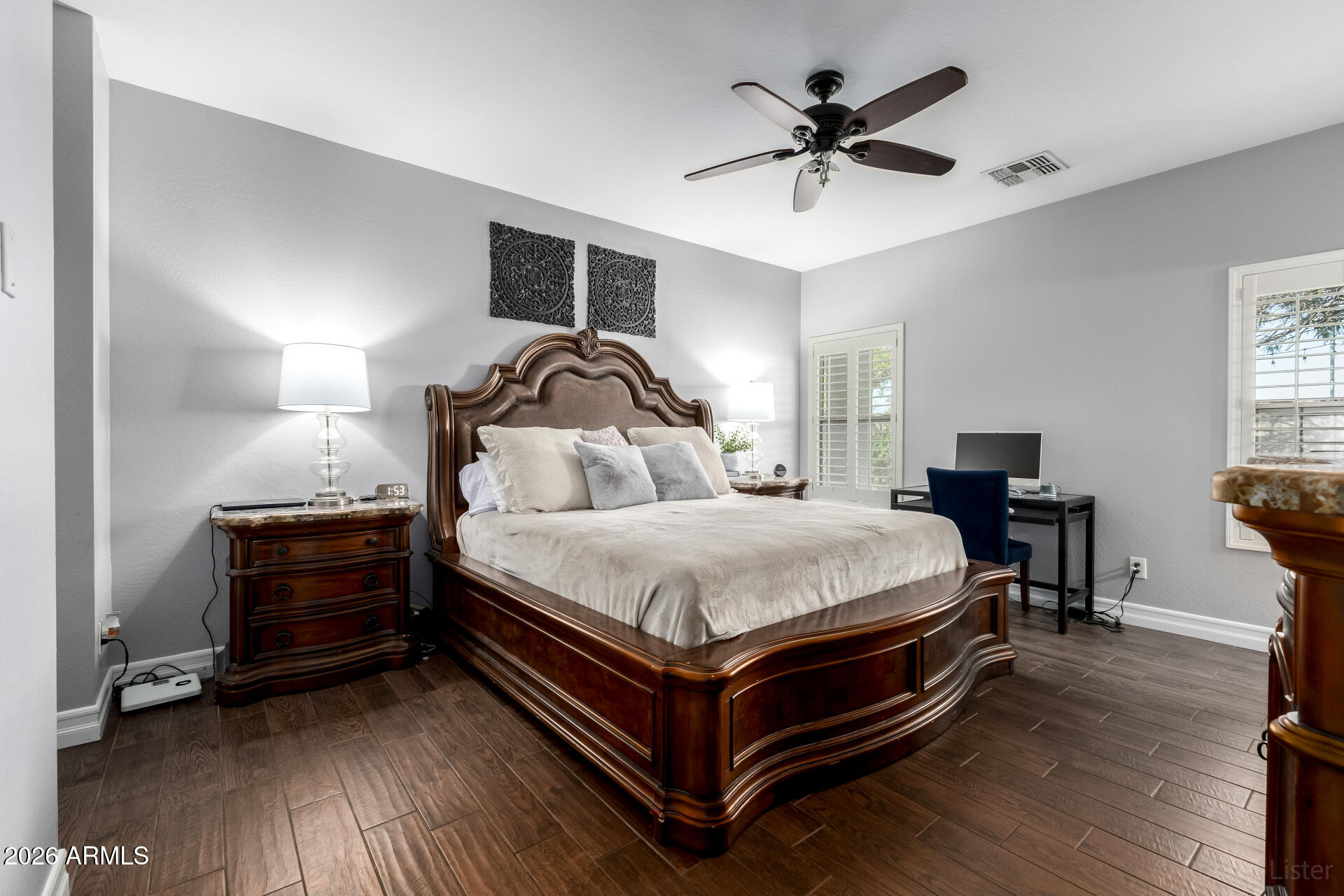 9646 West Payson Road Tolleson, AZ 85353 - Photo 19 of 36 a bedroom with bed and wooden floor