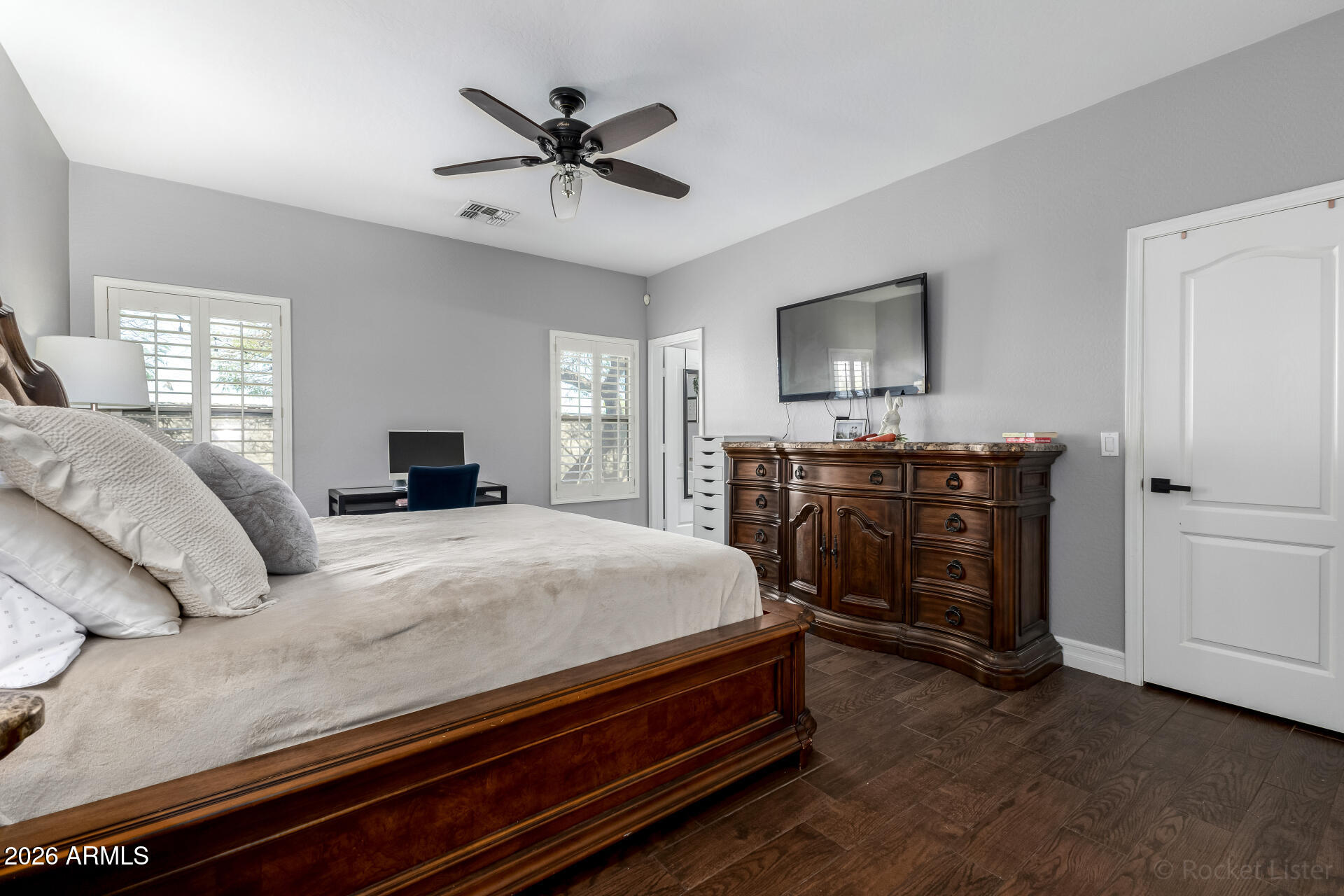 9646 West Payson Road Tolleson, AZ 85353 - Photo 20 of 36 a bedroom with a bed and a flat screen tv