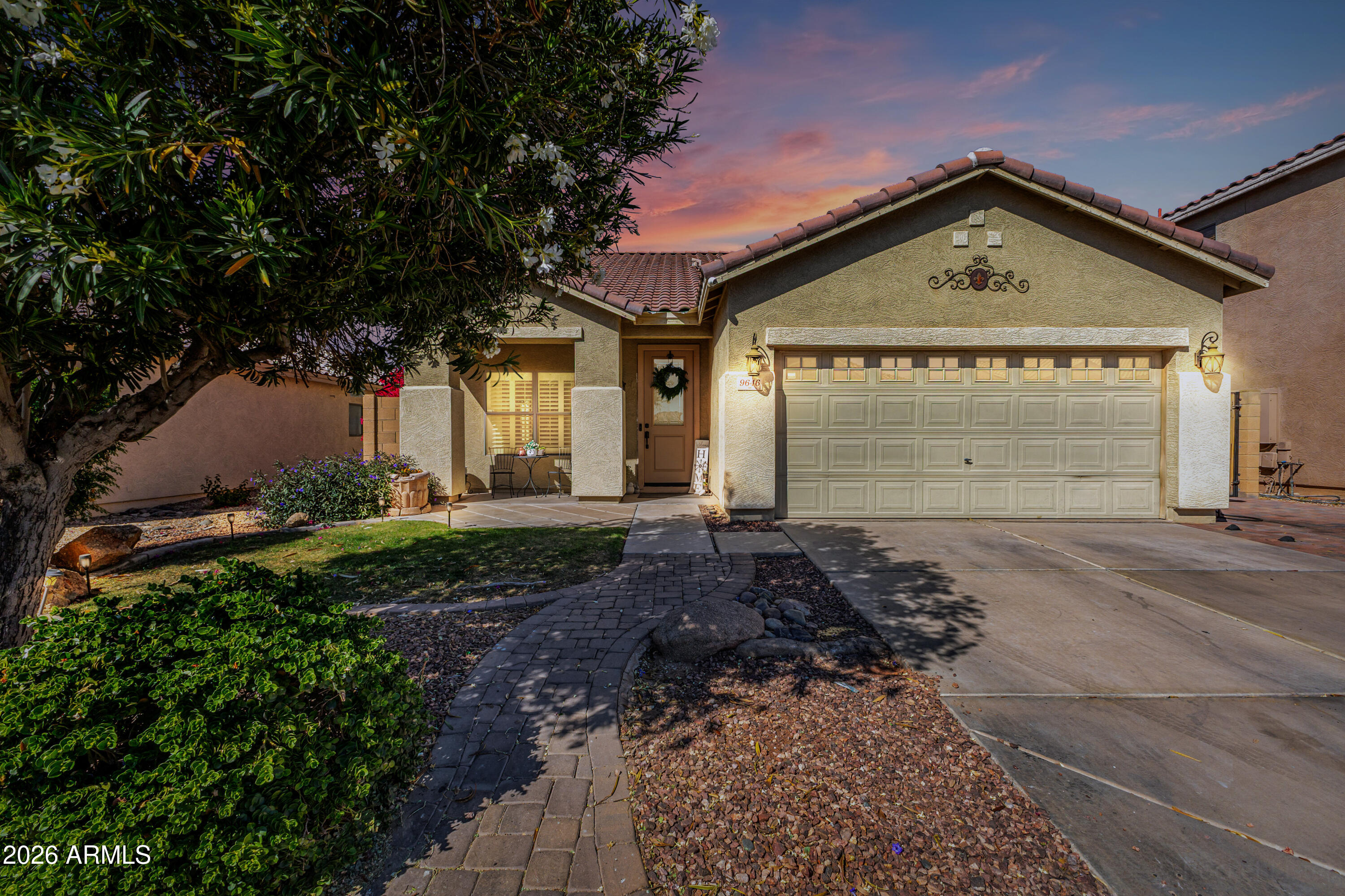 9646 West Payson Road Tolleson, AZ 85353 - Photo 2 of 36 a front view of a house with a yard