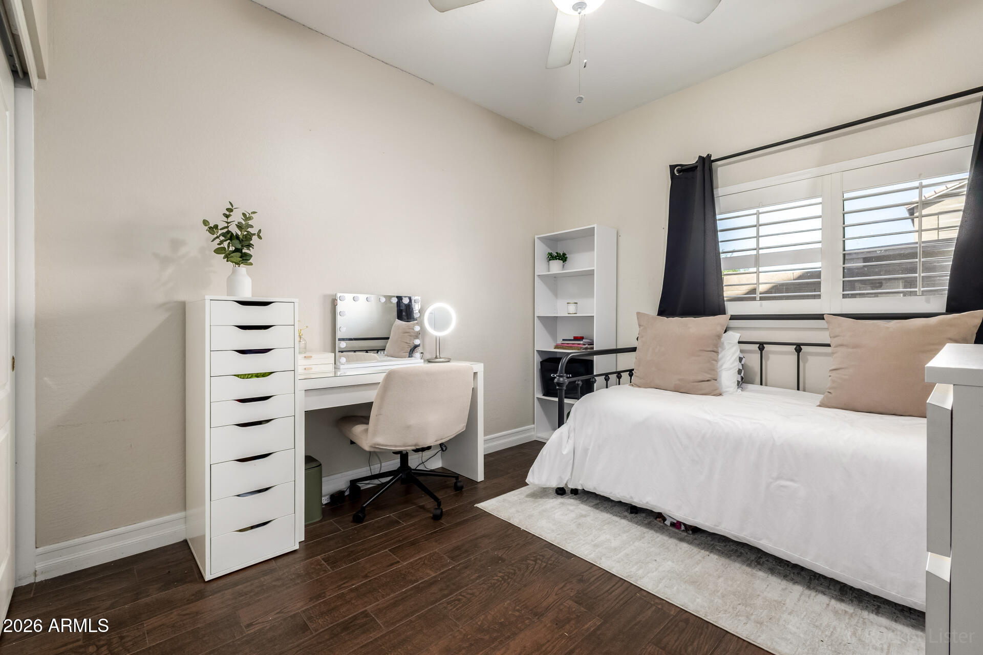9646 West Payson Road Tolleson, AZ 85353 - Photo 24 of 36 a bedroom with a bed and a dresser