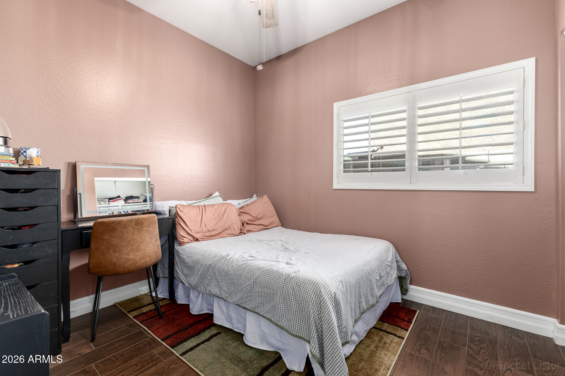 9646 West Payson Road Tolleson, AZ 85353 - Photo 26 of 36 a bedroom with a bed chair and a window