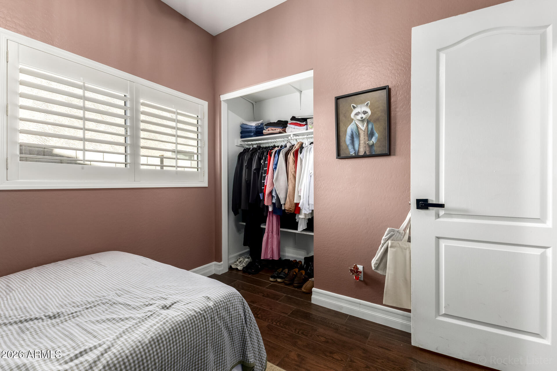 9646 West Payson Road Tolleson, AZ 85353 - Photo 27 of 36 a bedroom with a bed and a window