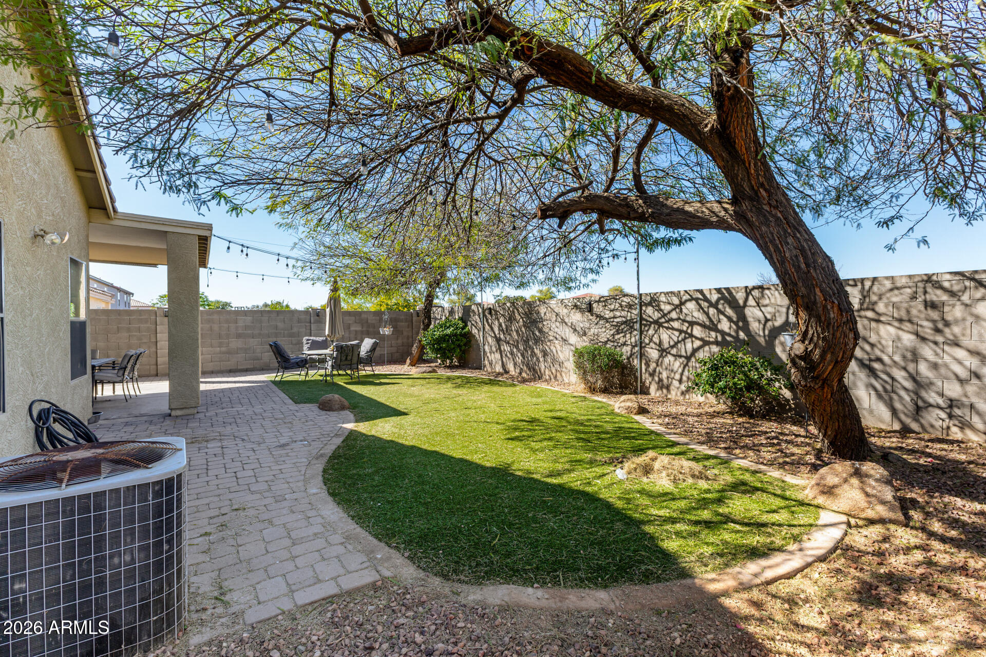 9646 West Payson Road Tolleson, AZ 85353 - Photo 32 of 36 a view of a backyard with large trees