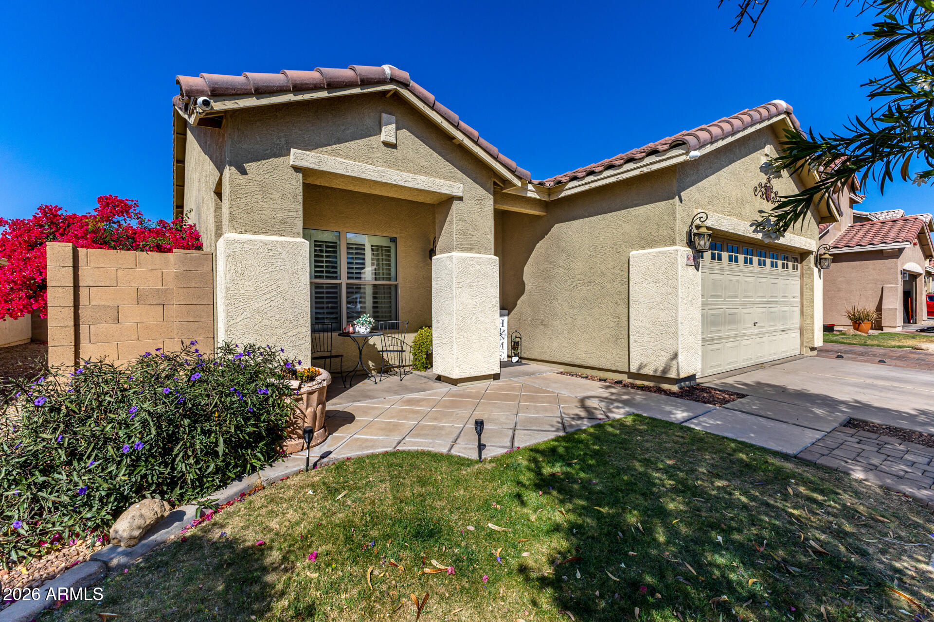 9646 West Payson Road Tolleson, AZ 85353 - Photo 5 of 36 a front view of a house with garden