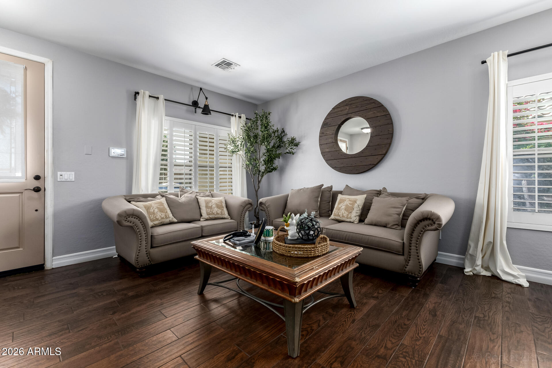 9646 West Payson Road Tolleson, AZ 85353 - Photo 7 of 36 a living room with furniture and a large window