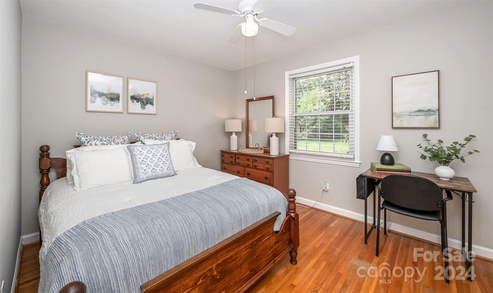 3117 Pendleton Avenue Charlotte, NC 28210 - Photo 12 of 25 a bedroom with a bed and a table