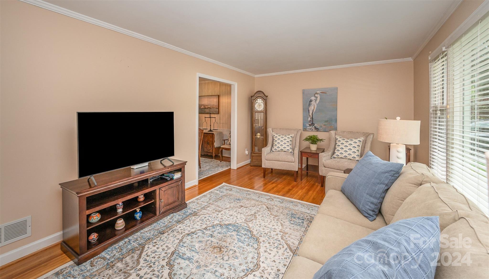 3117 Pendleton Avenue Charlotte, NC 28210 - Photo 4 of 25 a living room with furniture and a flat screen tv