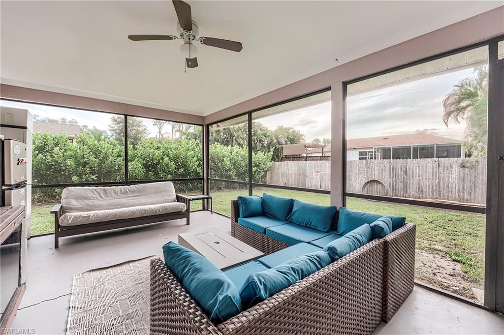 18257 Huckleberry Road Fort Myers, FL 33967 - Photo 14 of 18 a living room with couch and a large window