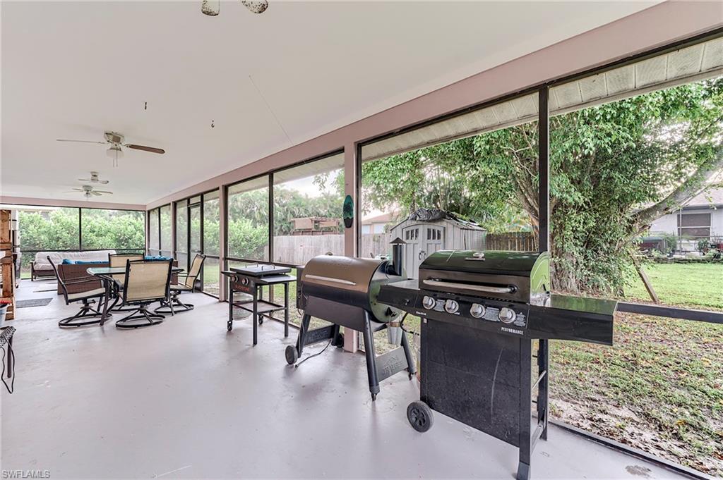 18257 Huckleberry Road Fort Myers, FL 33967 - Photo 15 of 18 a living room with furniture and a large window