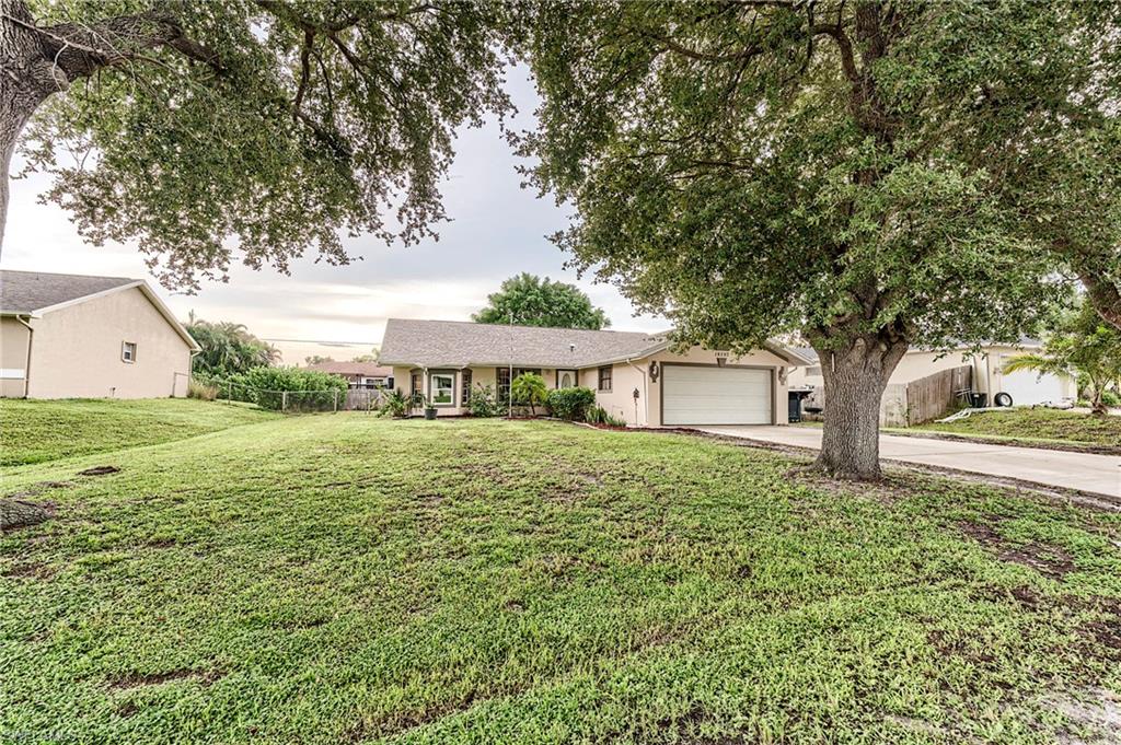 18257 Huckleberry Road Fort Myers, FL 33967 - Photo 17 of 18 a front view of a house with garden