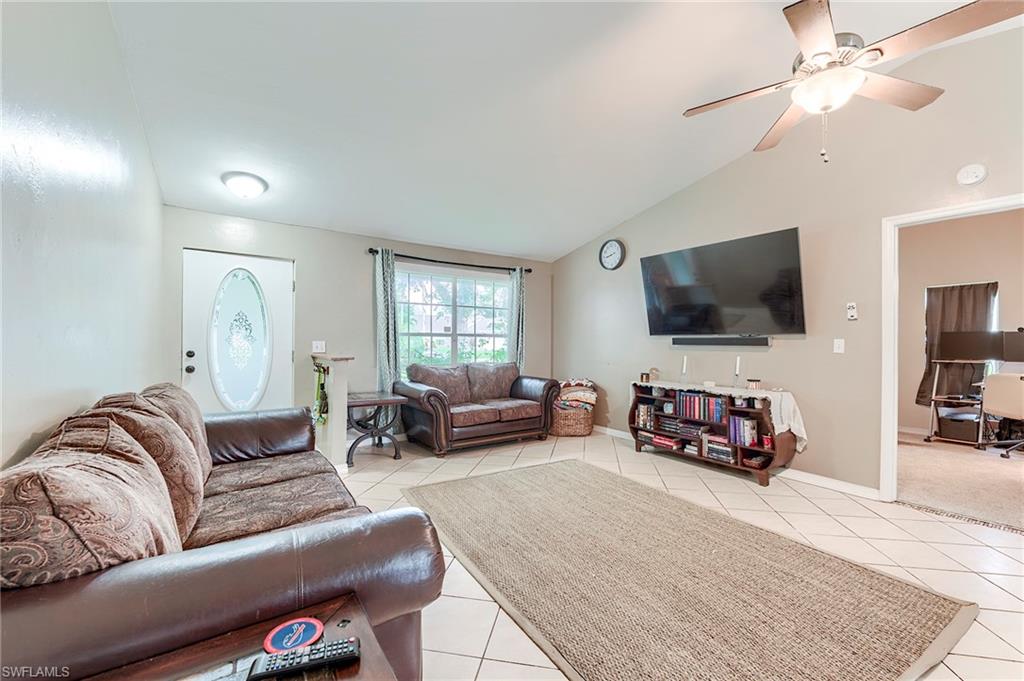 18257 Huckleberry Road Fort Myers, FL 33967 - Photo 4 of 18 a living room with furniture and a flat screen tv
