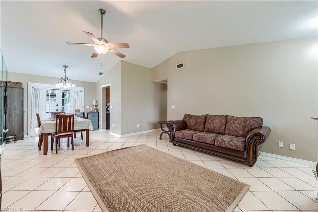 18257 Huckleberry Road Fort Myers, FL 33967 - Photo 5 of 18 a living room with furniture and a dining table