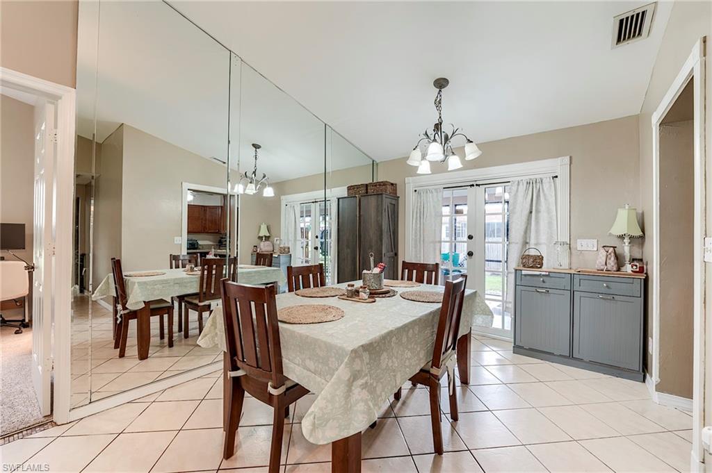 18257 Huckleberry Road Fort Myers, FL 33967 - Photo 6 of 18 a dining hall with stainless steel appliances a table and chairs