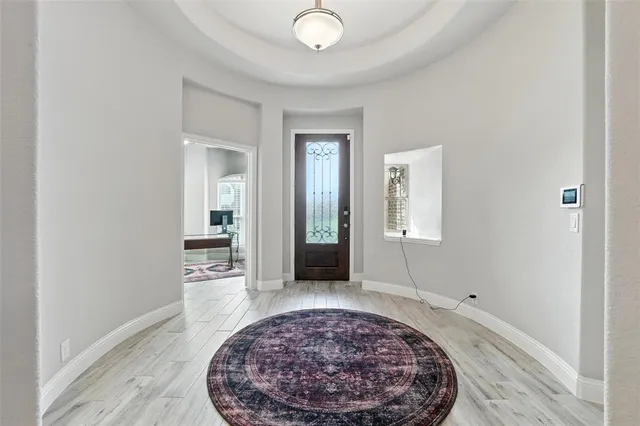 an entryway with a rug