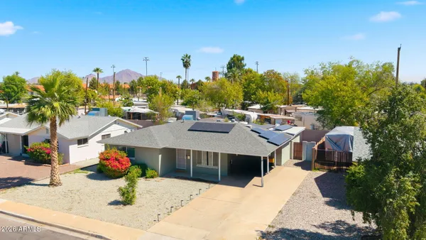 a view of a room with a window and ceiling fan