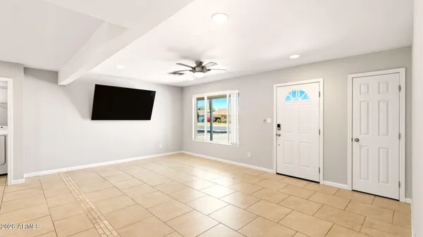 a view of a palm plant that is in front of a building