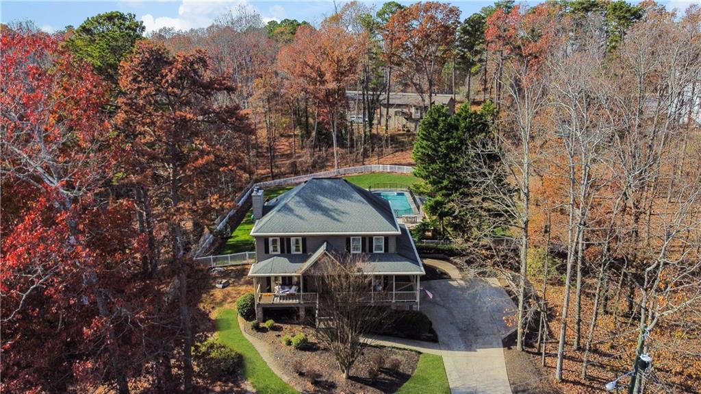a aerial view of a house with a yard