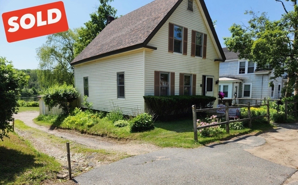 47 Beech Street Winchendon, MA 01475 - Photo 1 of 17 a front view of a house with garden and sitting area