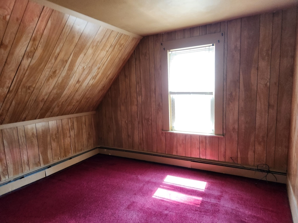 47 Beech Street Winchendon, MA 01475 - Photo 11 of 17 a view of an empty room with wooden floor and a window