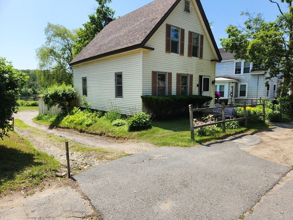 47 Beech Street Winchendon, MA 01475 - Photo 3 of 17 a view of house with a yard and table and chairs under an umbrella