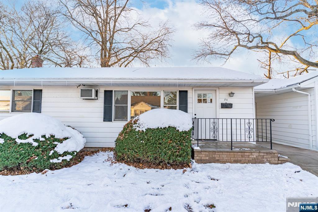 751 Hanson Avenue Perth Amboy, NJ 08861 - Photo 1 of 25 a front view of a house with a yard