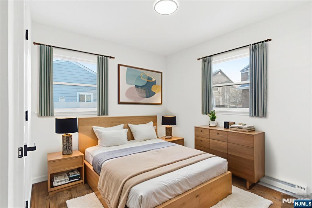 751 Hanson Avenue Perth Amboy, NJ 08861 - Photo 11 of 25 a bedroom with a bed and a window